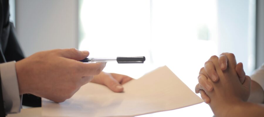crop businessman giving contract to woman to sign