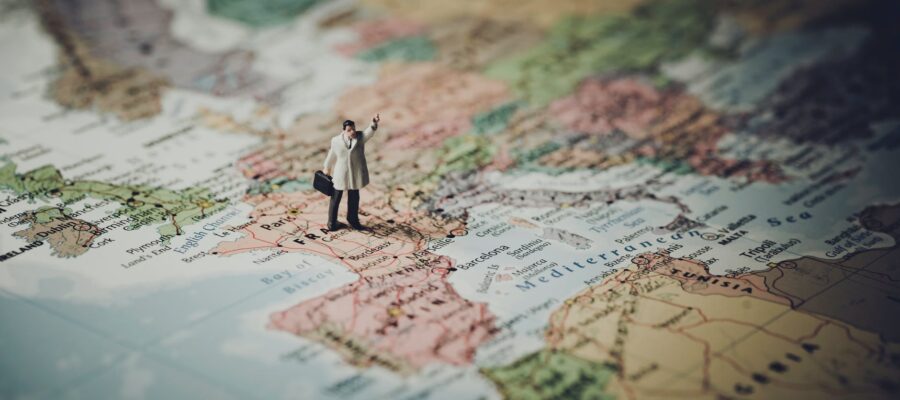 model figure standing on map