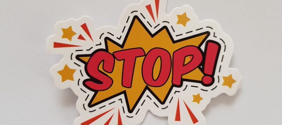 red and yellow stop sticker