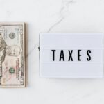 american dollar bills and vintage light box with inscription