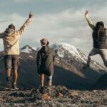 people standing on rocky mountain