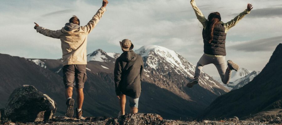 people standing on rocky mountain